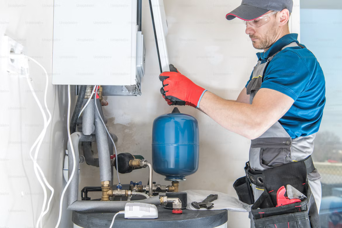 Plumber in California installing a residential water heater