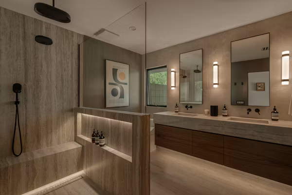 Bathroom remodel in Atwater featuring a modern vanity and walk-in shower.